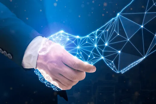 Man Shaking Hands with Robotic Hand